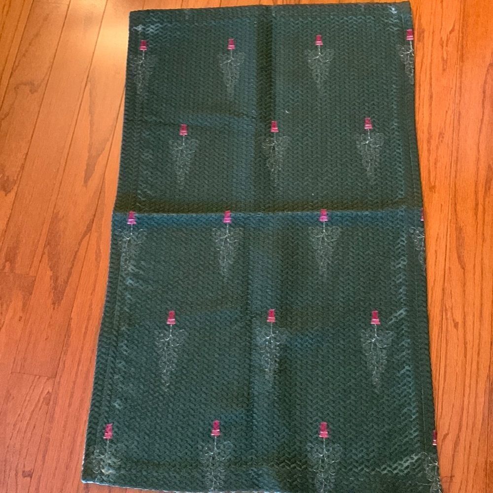GREEN AREA RUG with design of red vase/tree decor.  21.5" X 34.5"